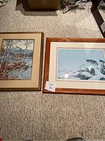 Two framed prints on carpeted floor including Eric Blais limited edition and Keirstead landscape print