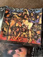 Front of the album sleeve showing colorful artwork with The Tragically Hip and Fully Completely text.