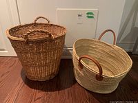 Two wicker baskets side by side on hardwood floor, show scale and shape differences