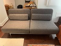 Futon in sofa configuration, showing three-seat upholstered surface