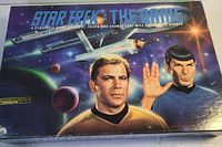 Box cover featuring artwork of Captain Kirk, Spock, and a starship, signifying the Star Trek game theme.