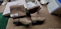 Photo shows the pair of tan suede mid-calf Candie's ladies boots with original box and tissue paper, new with tags attached.