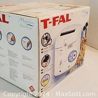 Box of T-fal Magiclean deep fryer showing front and side with product images and branding.