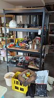Shelf with tools, hard hat, containers with assorted hardware and accessories