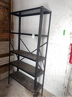 Full view of the shelving unit showing the entire frame and all four shelves.