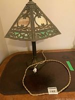Full view of lamp showing base, shade, and braided cord.