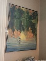 Full view of the landscape painting in metal frame