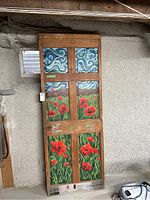 Full front view of the painted door showing six-panel design and signatures
