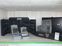 Full view of drill bit sets in plastic cases and a black metal Craftsman toolbox with socket and drill bit sets.