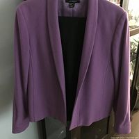 Photo of the mauve Louben jacket hanging showing color and style details