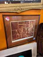 Framed limited serigraph print in sepia tones featuring an elderly woman sitting indoors, framed with a double matte and glass.