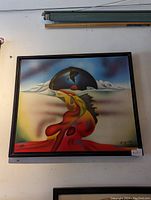 Colorful funky abstract painting with surreal elements in a black frame.