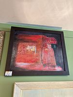Framed original abstract painting signed Keller in corner, predominantly red with textured geometric shapes and some gold and black tones.