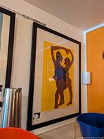 Photo of Partner Print 20x26 inch framed print with stylized silhouettes making a heart shape in bright colors on yellow background.