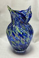 Front view of the owl-shaped glass vase showing overall color and form