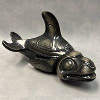 Front and side view showing the orca whale spirit box with detailed Haida style carvings and the removable dorsal fin lid.