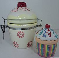Both ceramic cupcake-themed items side by side to show scale and design