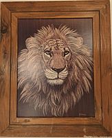 Front view of the framed lion lithograph showing detailed lion face and mane in shades of brown and beige within rustic wood frame.