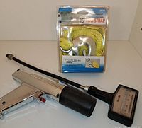 Photo showing All Pro timing light, Cal Custom compression tester with flexible hose, and Highland 15' tow strap in original packaging.