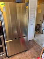 Front view of stainless steel refrigerator with bottom freezer drawer
