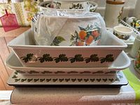 Stacked Portmeirion Pomona ceramic bowls and placemats showing pattern and sizes.