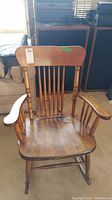 Front view of wooden rocking chair showing overall design