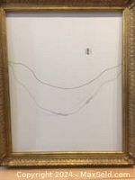 Full view of the back of the empty antique gold frame showing wire hanging system