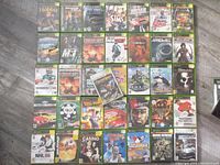 Top-down view of all 36 original Xbox games laid out on a surface, showing front cover artwork of each game.