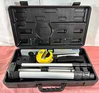 Opened view of complete kit showing all items arranged inside the molded black hard carrying case with lid open.