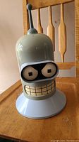 Front view of the Bender head CD holder showing Bender's face and antenna