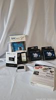 Full lot with BACtrack breathalyzer in box, user manual, two packages of breathalyzer mouthpieces, the second breathalyzer device, and Auto Find keychain
