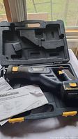 Mastercraft cordless reciprocating saw and battery in molded black plastic carrying case with operating manual.