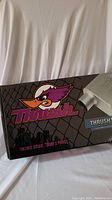 Box front showing Thrush logo, muffler image and vintage sound slogan