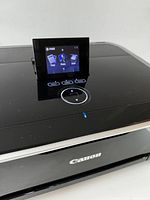 Top view of printer showing fold-out touchscreen and control buttons