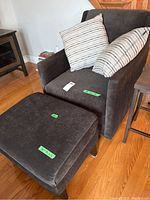 Front angle showing chair, ottoman and two pillows