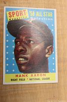Front of card showing color portrait of Hank Aaron under 'Sport Magazine '58 All Star Selection' header
