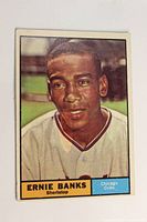 Front of 1961 Topps Ernie Banks baseball card showing color portrait and text.