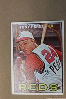 Front of 1967 Topps Tony Perez baseball card showing player in batting stance with Reds jersey and cap, card number 476, and name in white text on colored background.