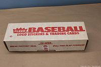 White rectangular Fleer Baseball Logo Stickers & Trading Cards box, front showing brand and product info, unopened except factory seal is broken.