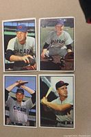 Four 1953 Bowman baseball cards featuring Toby Atwell, Bob Rush, Paul Minner, Ken Wood. All cards color printed with players in uniforms, showing varied condition.