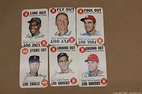 Photo showing all six 1968 Topps baseball game cards including Pete Rose, Jim Lonborg, Joe Torre, Rusty Staub, George Scott, and Tim McCarver with various play actions.