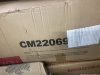 Box showing model number CM22069 and packaging with slight damage visible.