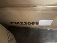 Photo of cardboard box with model number CM22068