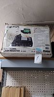 Original box of Casio Electronic Cash Register SE-S800 showing product image and specs.