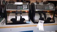 Two RBC 4500 currency bill counters side by side showing front and control panels