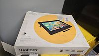 Front of Wacom Cintiq box showing model graphic and stylus