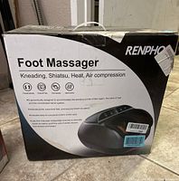 Box of Renpho Foot Massager showing product name, image, and features such as kneading, shiatsu, heat, and air compression.