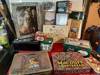 Overview photo showing the full collection of 15 collectible tins with varied designs and sizes.