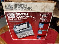 Photo of the original Smith Corona box showing model SL580 and branding with usage wear.