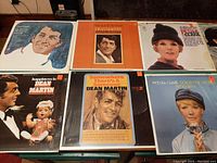 Photo showing 6 vinyl records with visible album covers including Dean Martin and Petula Clark albums.